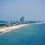 Banner plane in Orange Beach pulls ad for OnlyFans account; mayor and beachgoers furious